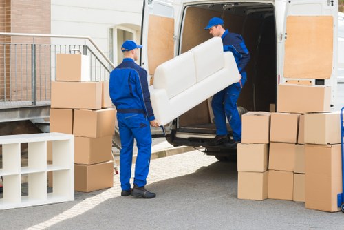 Moving team handling furniture carefully during a move