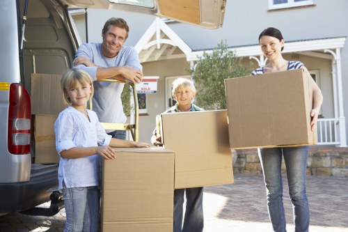 Local moving truck loading boxes and furniture near Crystal Palace homes